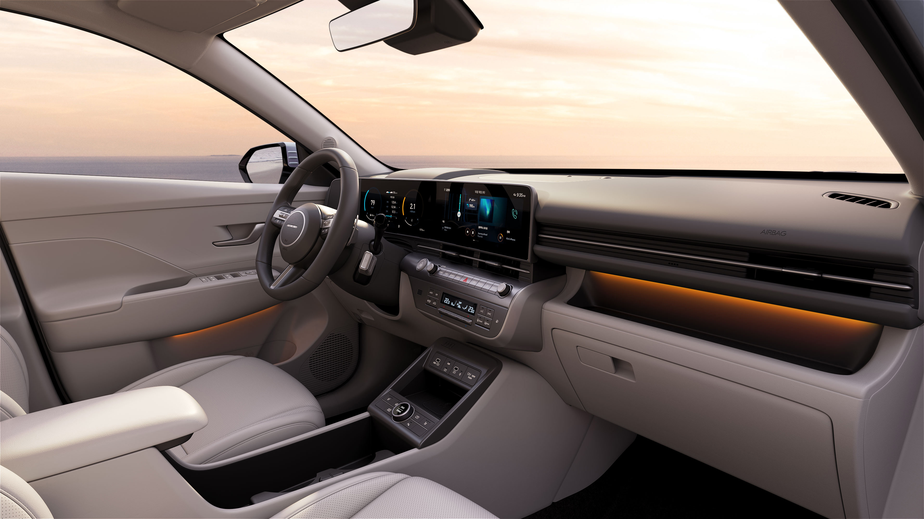 	The cockpit of the Hyundai KONA SUV with orange ambient lighting. 