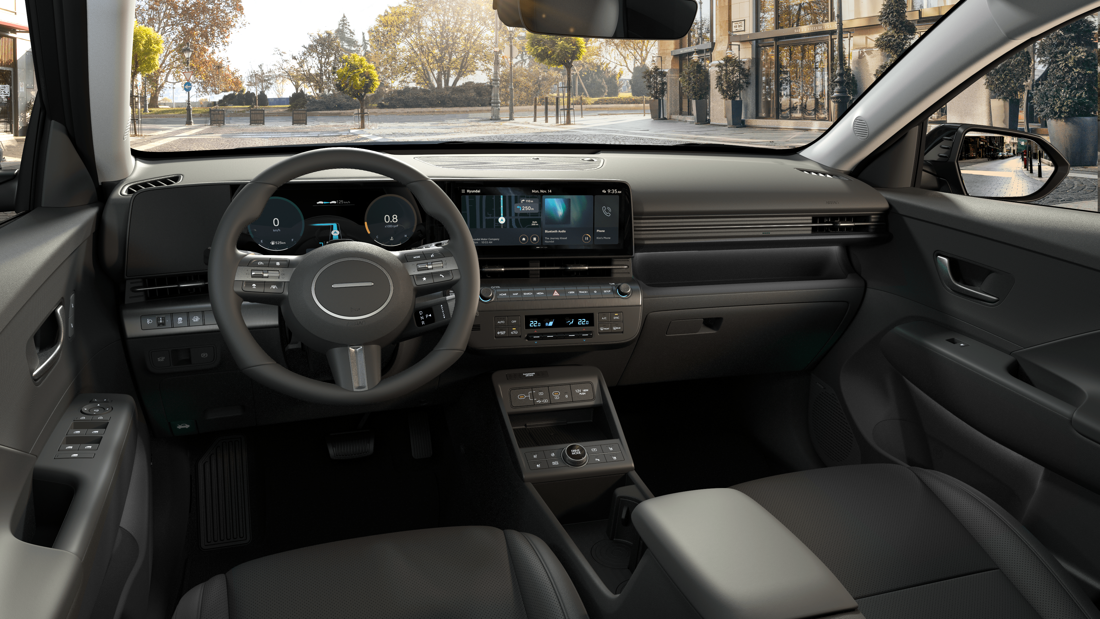 The cockpit of the Hyundai KONA SUV with dual screen panoramic display and ambient lighting.
