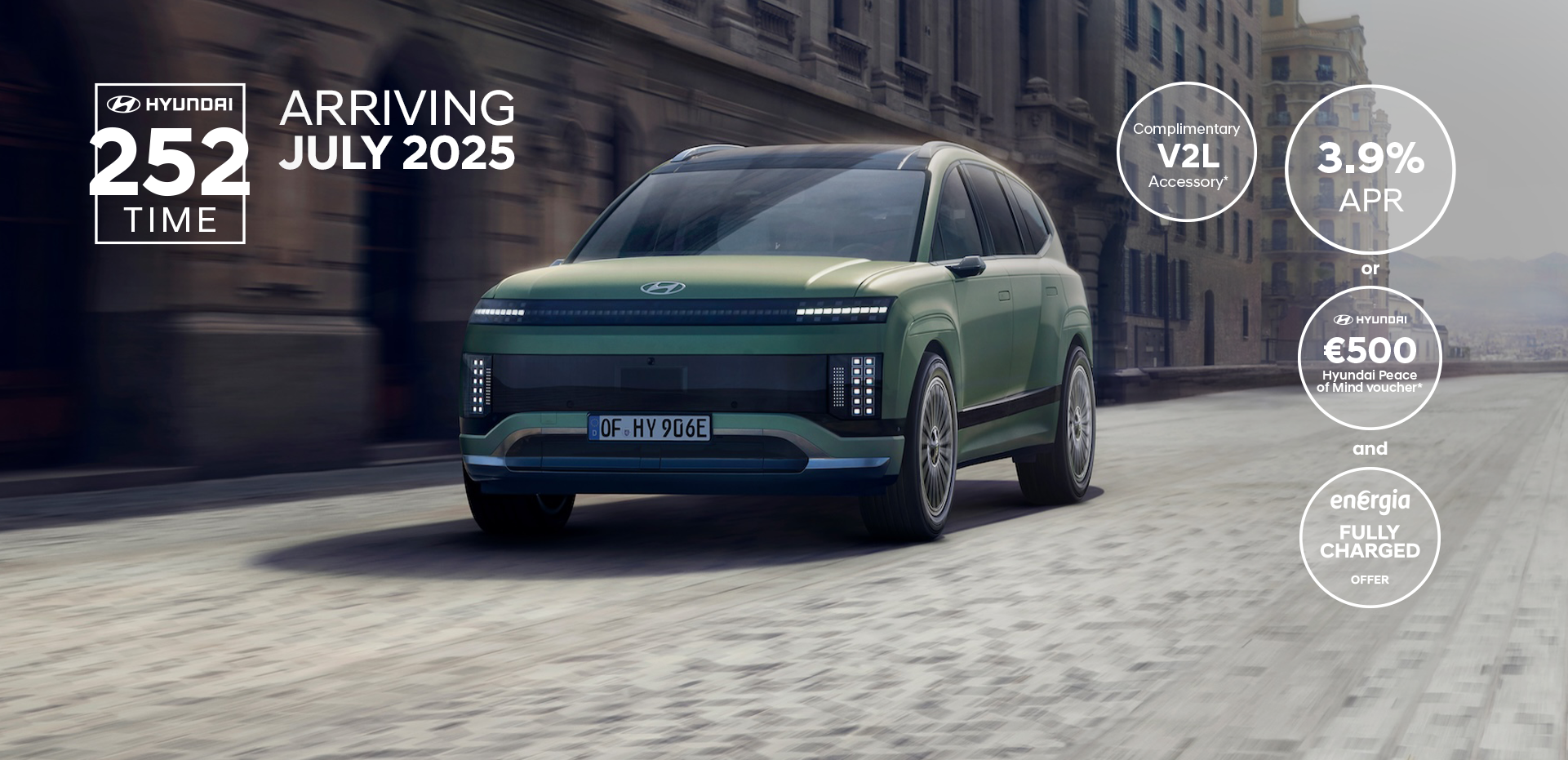 Three-quarter view of the new Hyundai IONIQ 9 driving in the city.	