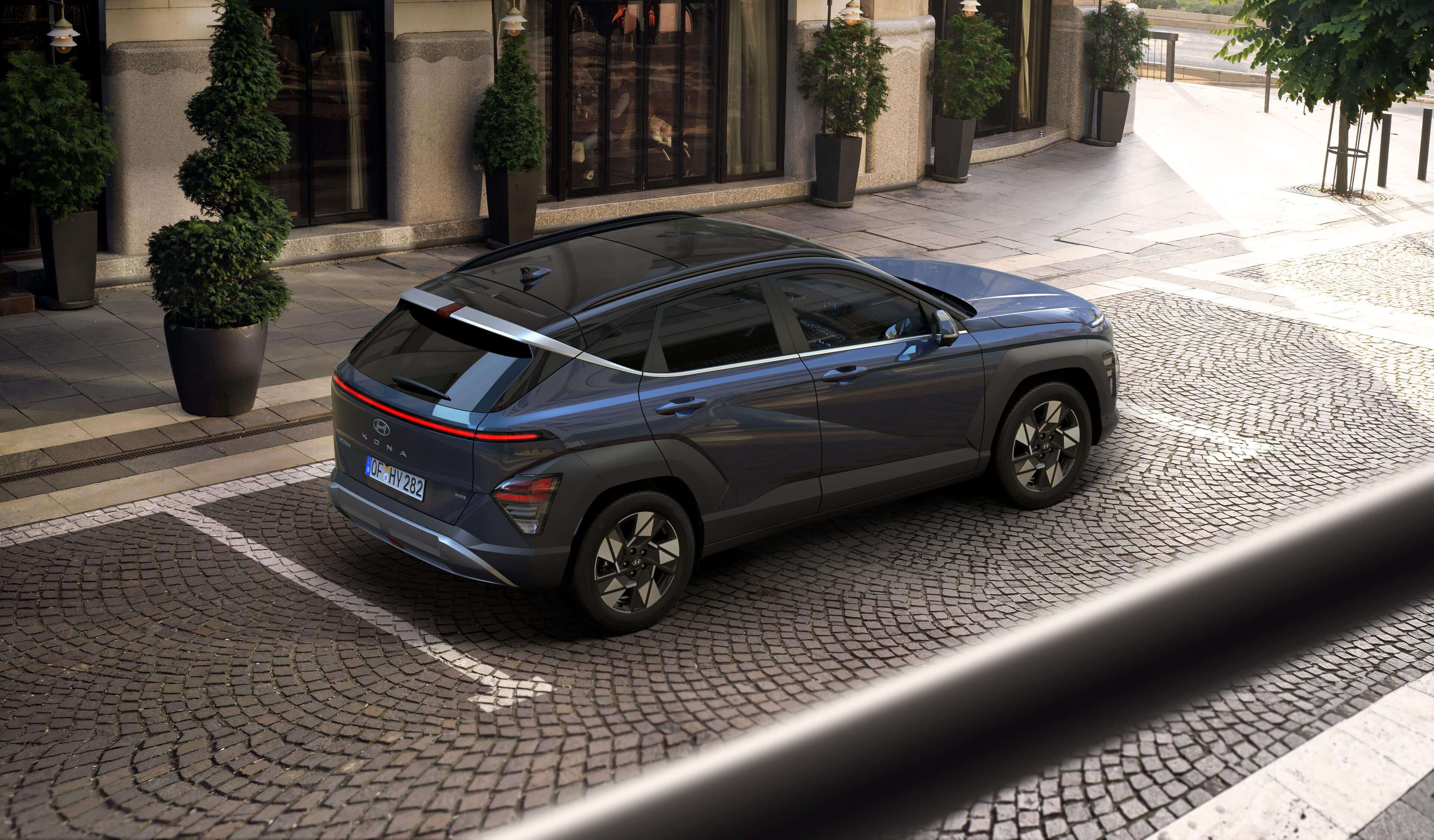 The rear tailgate of the all-new Hyundai KONA Hybrid showing the rear lights.