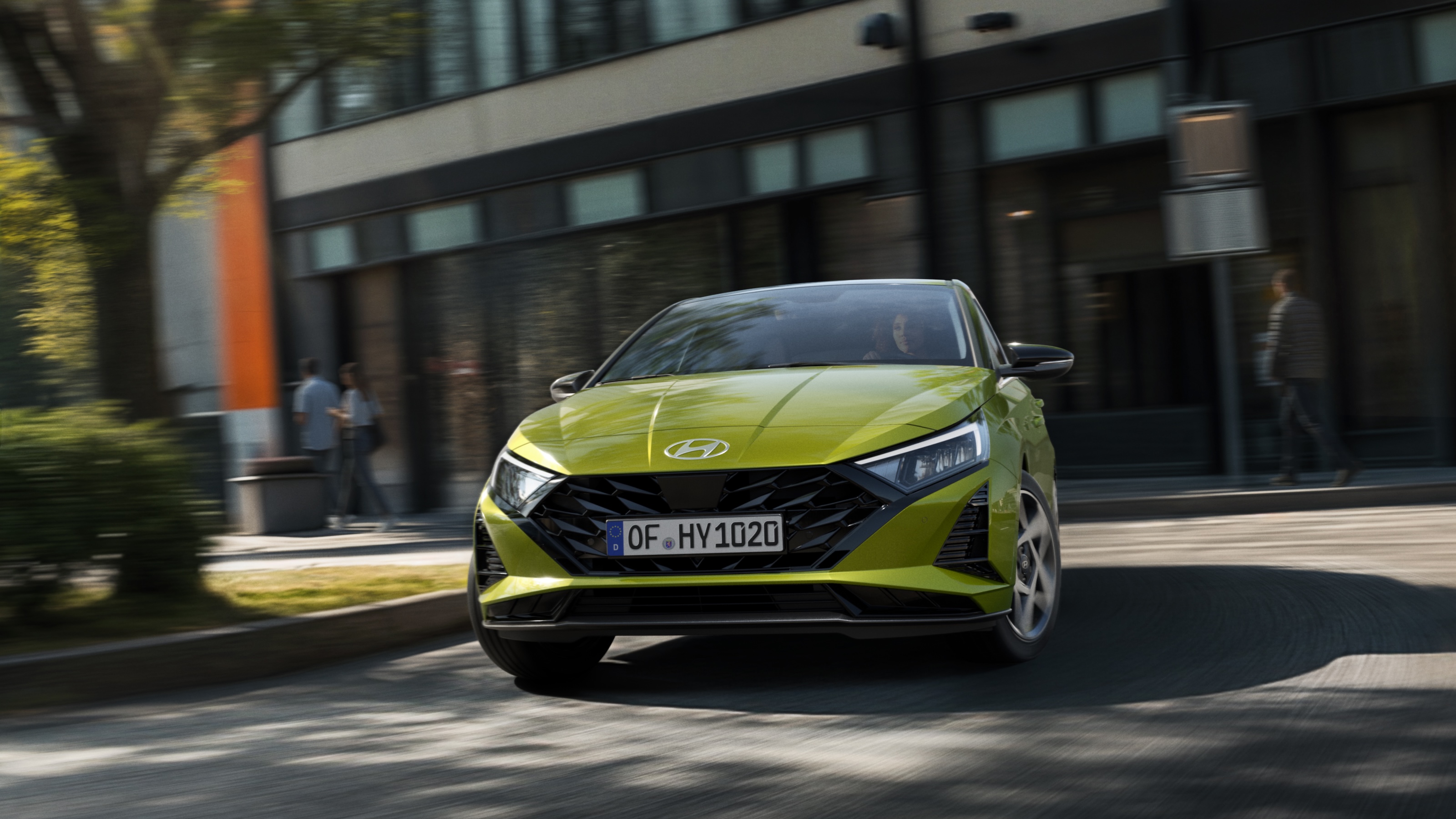 The Hyundai i20 driving down a street.&nbsp;