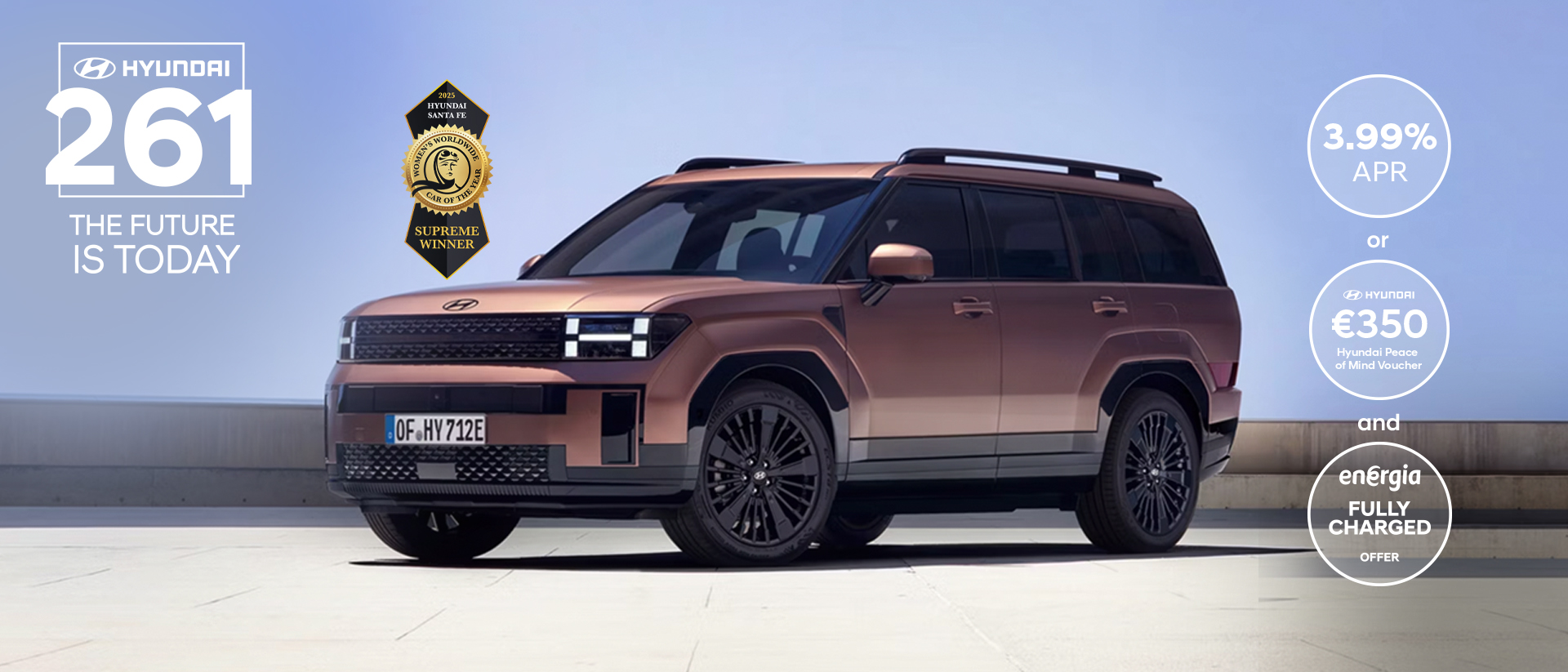 The Hyundai Santa Fe parked in an open garage. 	