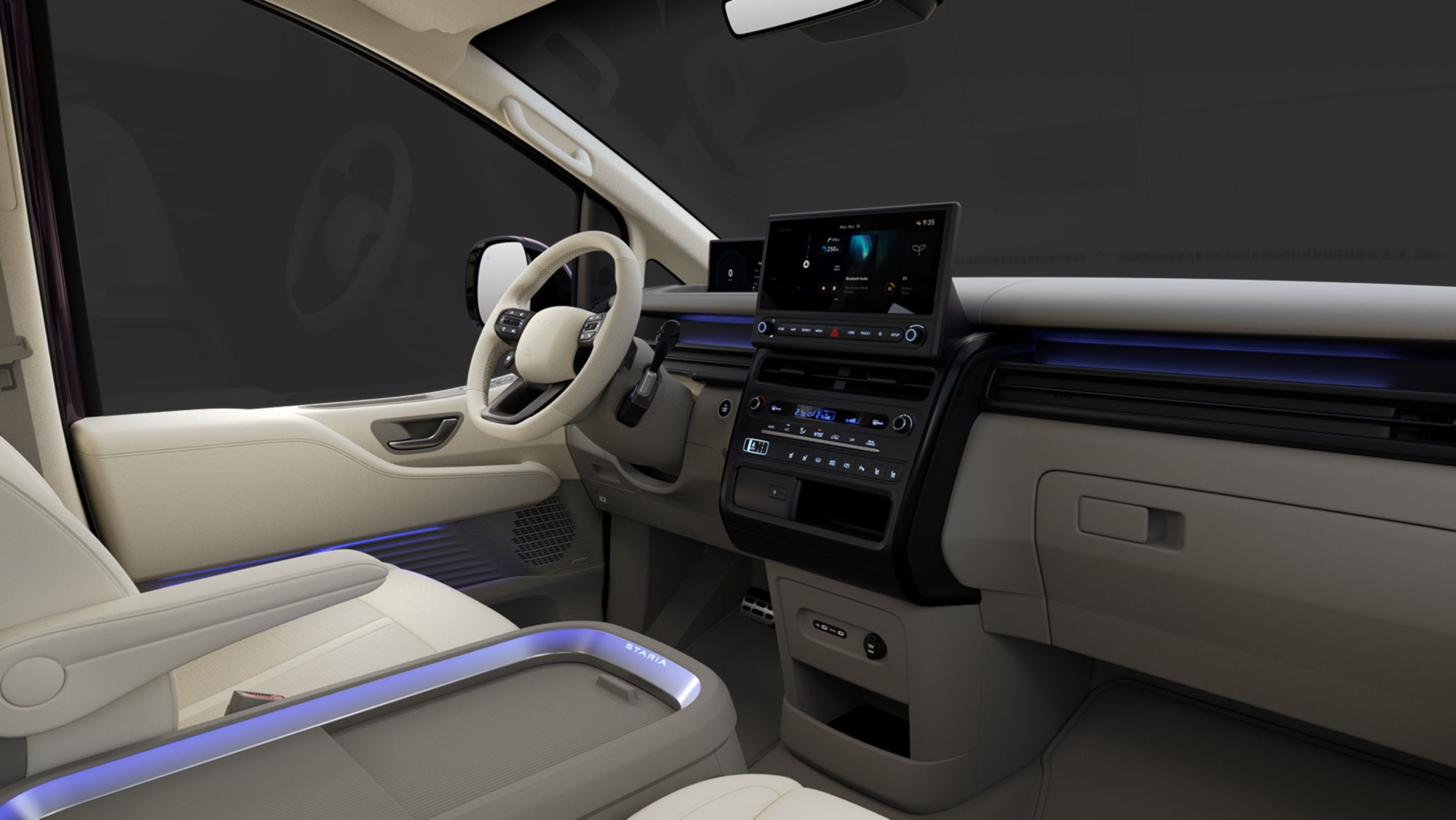 Hyundai STARIA Electric front interior with horizontal dashboard design, ambient lighting, and infotainment display.