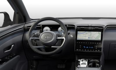 Interior view of the All-New Hyundai Tucson Hybrid compact SUV showing its steering wheel. 