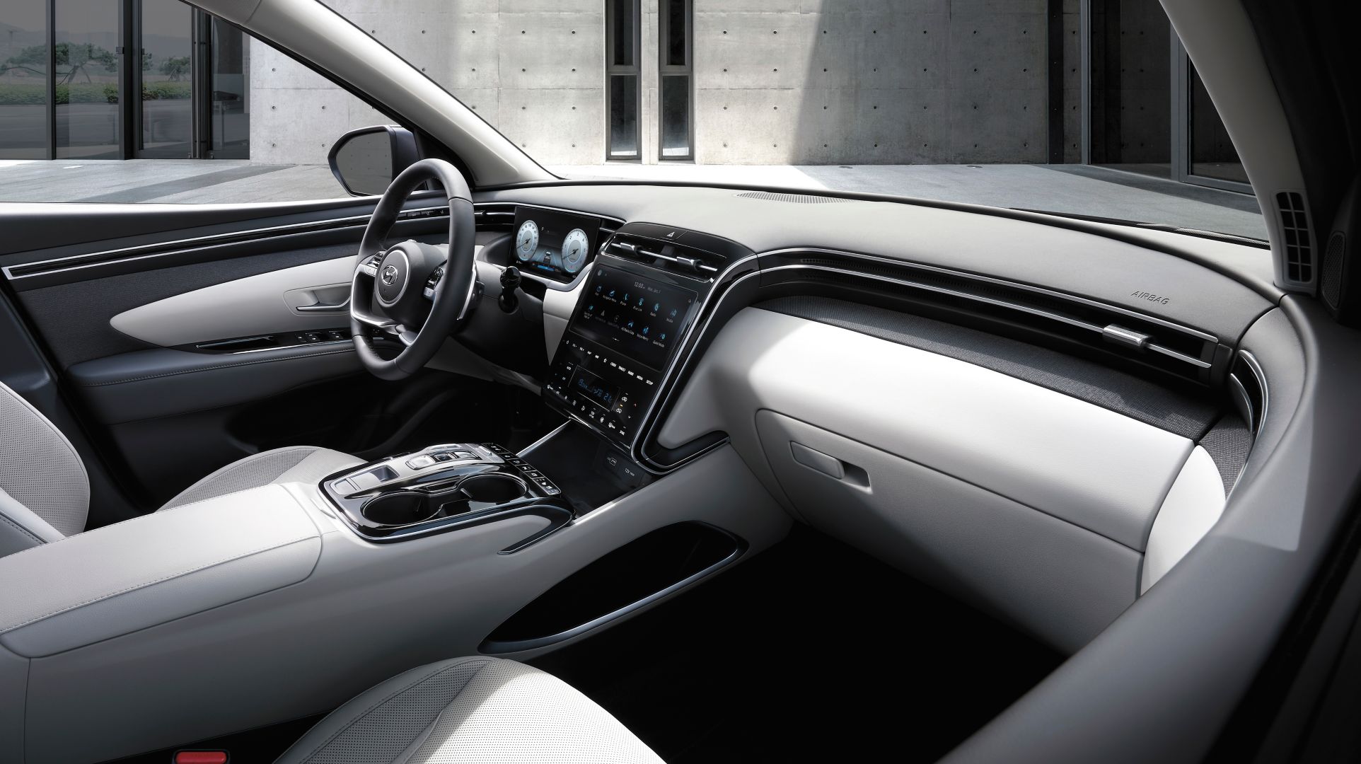 Interior design view of the All-New Hyundai Tucson Hybrid compact SUV's cockpit.
